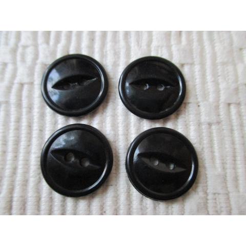 4 fina svarta kattögon knappar 18 mm. Se bilderna.