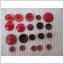 20 Röda, mörkrosa och vinröda knappar 11 - 22 mm.